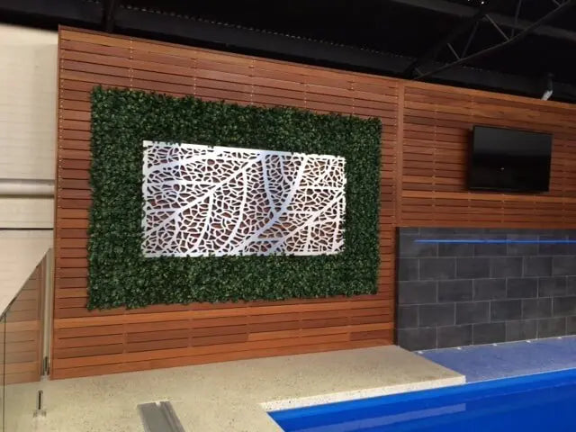 Artificial Hedge Panels Installed at A Pool Shop Display with Metal Wall Art