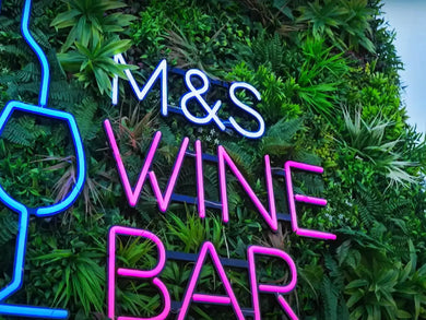 Business signage with green wall panels