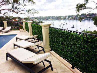 Artificial Hedge Panels Installed along a fence over a river